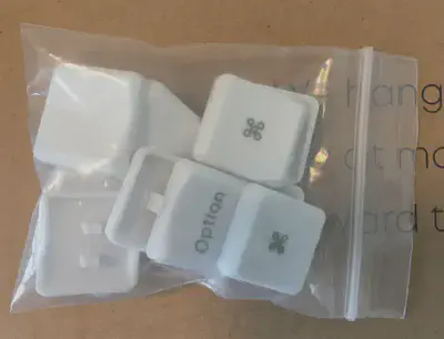 a picture of a zip-lock bag with &lsquo;Option&rsquo; and &lsquo;Command&rsquo; keycaps