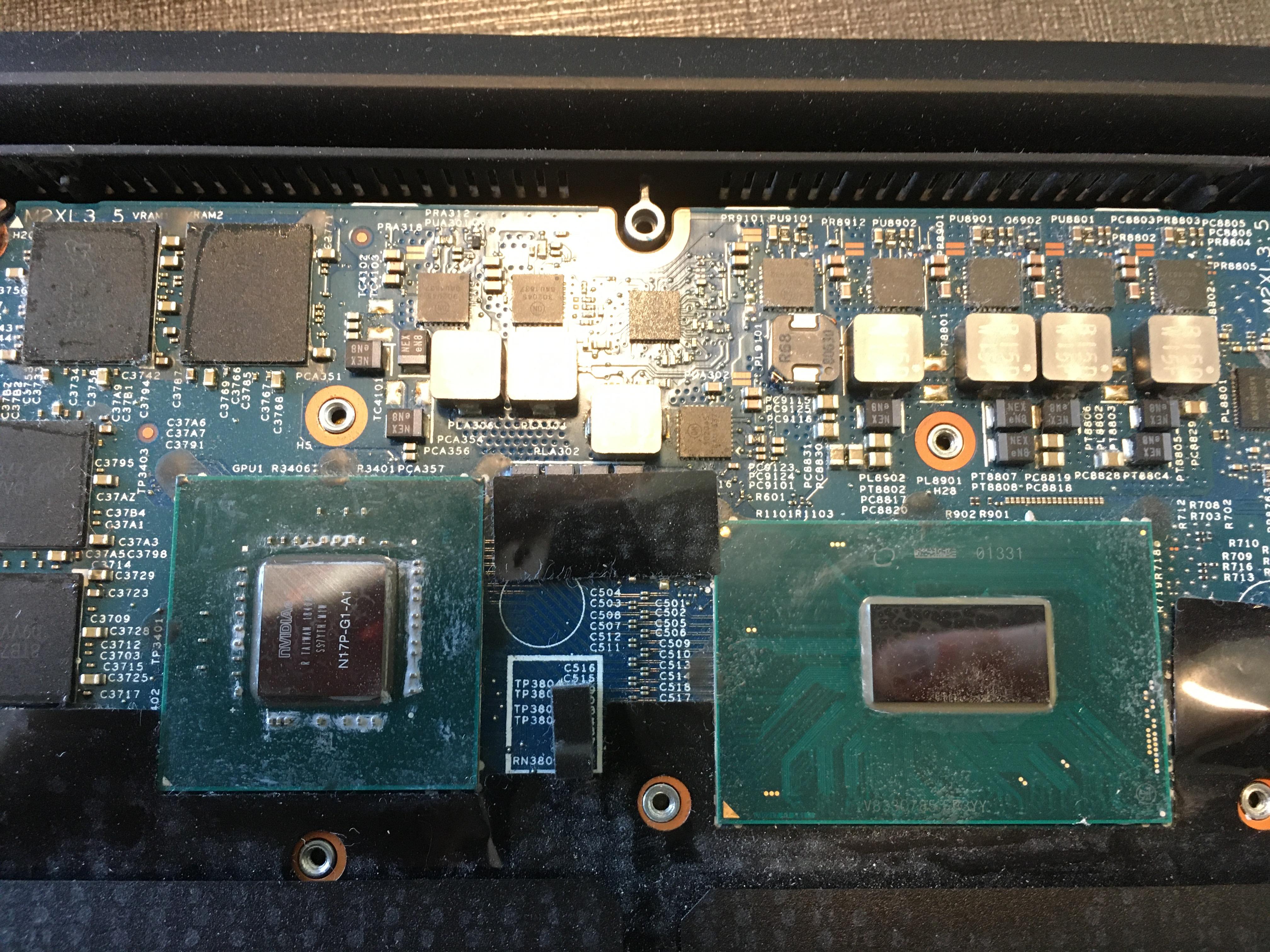 The GPU and CPU dies on the motherboard; about 1 by 1 cm and 1 by 3 cm respectively